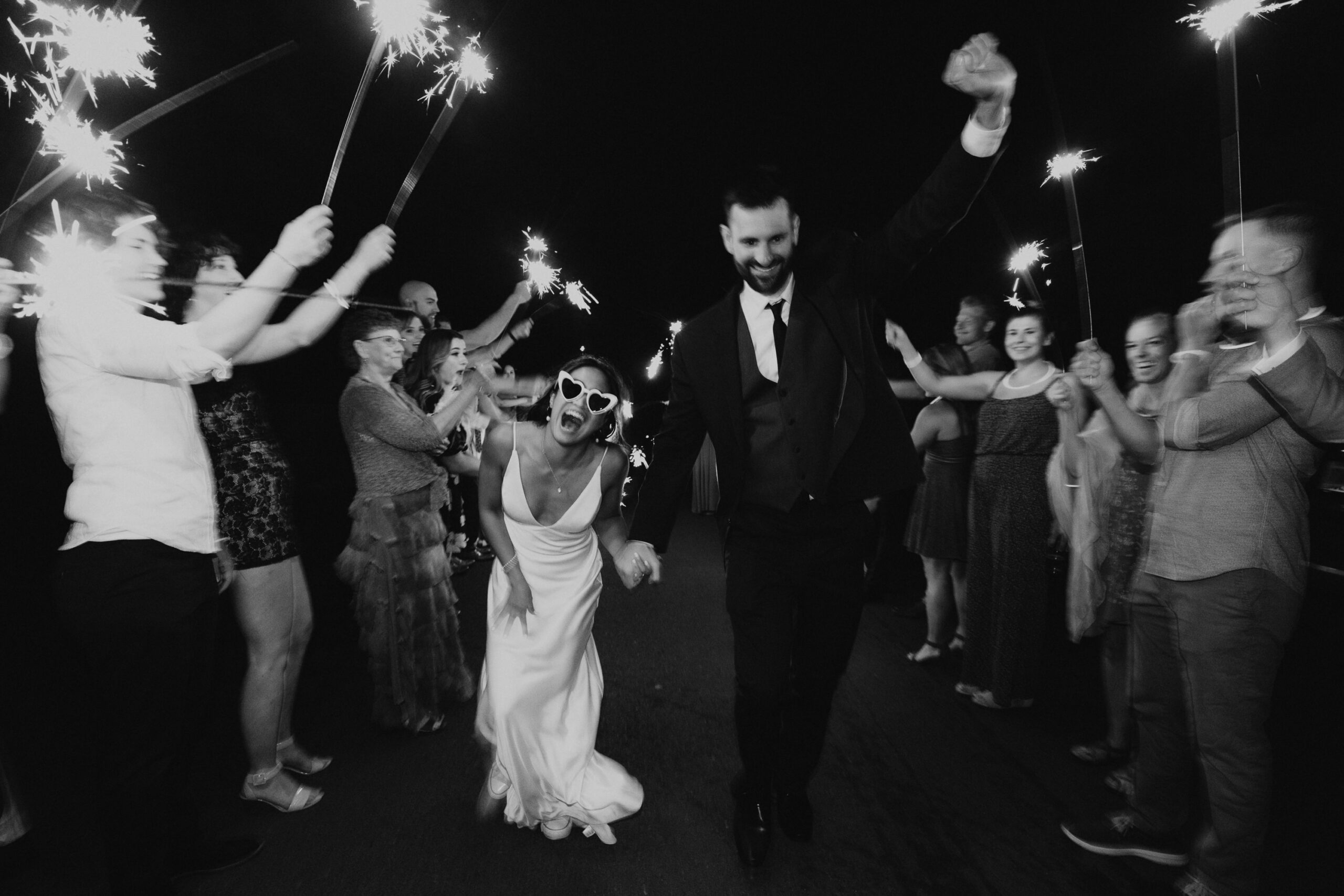 Phil and Suzan exiting their reception after a beautiful wedding day full of their family and friends.